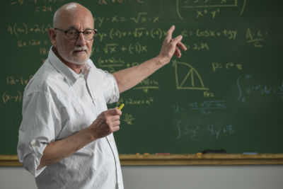 Male professor teaching in class